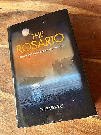 The Rosario by Peter Sissons on a table