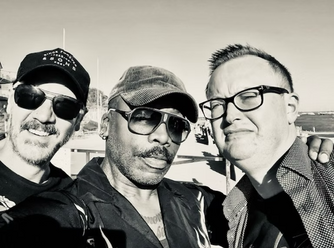 A photograph of ROY INC and friends.