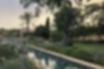 A beautiful landscaped garden in the summer designed by Filippo Dimatteo Studio.