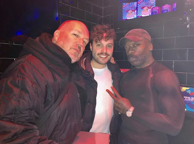 A photograph of ROY INC and friends.