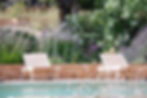 A beautiful landscaped garden in the summer designed by Filippo Dimatteo Studio.