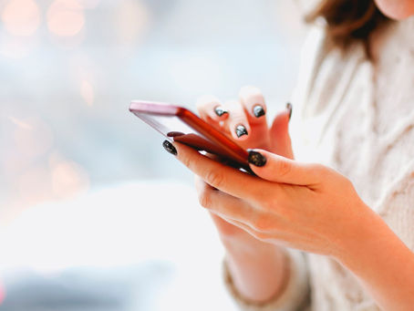 Person checking phone contract cancellation options on mobile