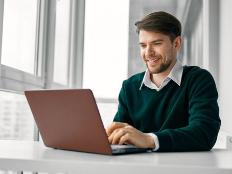 UK homeowner comparing bundled insurance policies on laptop
