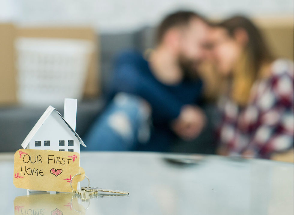 Young couple reviewing a mortgage checklist at home with laptop and paperwork