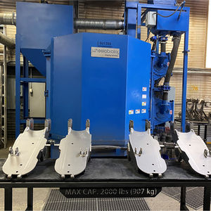 4 Machined parts in front of machine