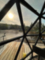 Geodome project showcase featuring a river view at sunset.
