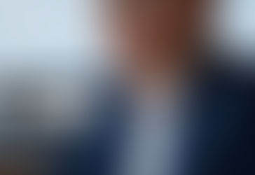 Smiling woman engaged in conversation, symbolising counselling, empathy, and effective communication skills