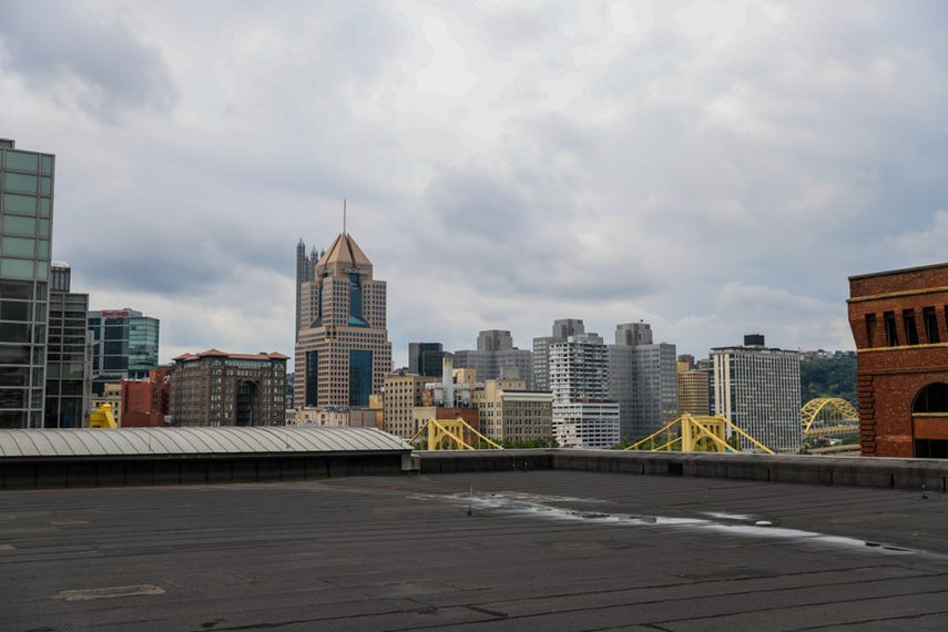 Flat roof in Pittsburgh with skyline in background