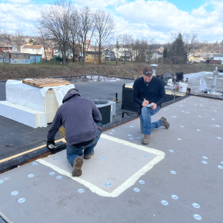 roofing crew installing EPDM roof