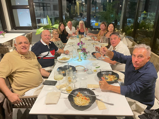 Group of Italian guests enjoying handmade pasta and wine at La Calabrese, Surfers Paradise
