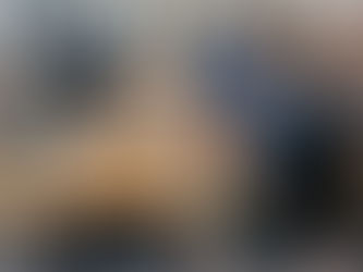 three guys in discussion in an office