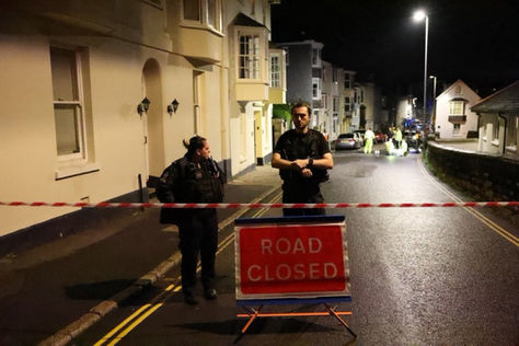 A woman was murdered last night with an axe by a "British National".