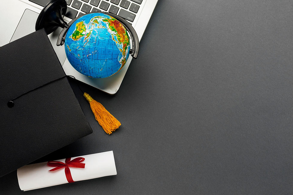 top-view-laptop-with-diploma-globe.jpg
