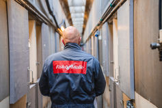 Worker in overalls in a production facility – reportage photo