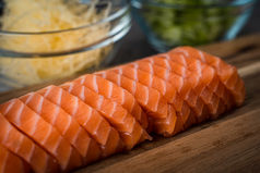 Smoked salmon on a wooden board – food photography