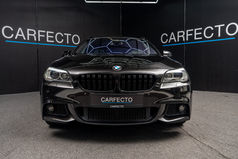 Black car from the front in the studio – car photography for dealers