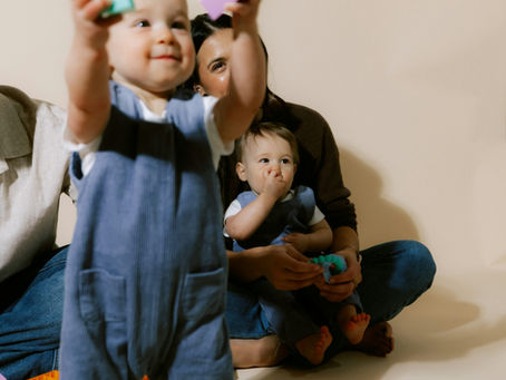 Parent and child playing simple People Games to encourage communication and talking
