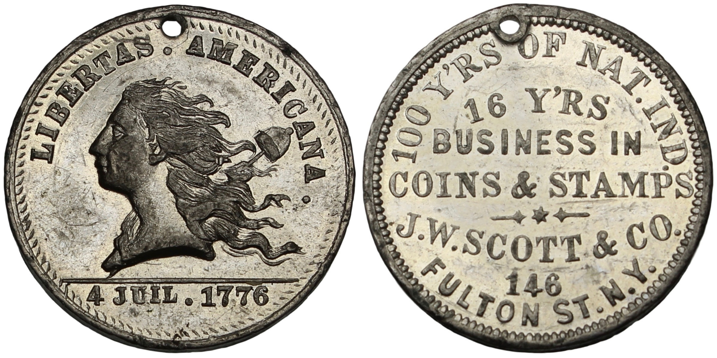 100937  |  UNITED STATES. Libertas Americana/J. W. Scott white metal Token.
