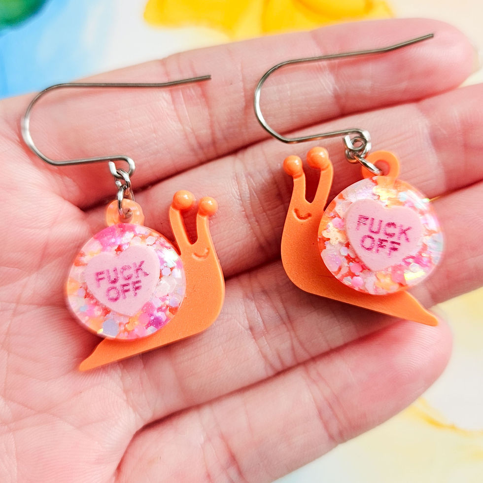 Thumbnail: Handmade cute rude snails resin earrings, glitter and orange