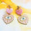 Thumbnail: Handmade pink and gold resin and enamel evil eye earrings