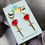 Thumbnail: Handmade resin red heart huggie hoops with stainless steel dagger