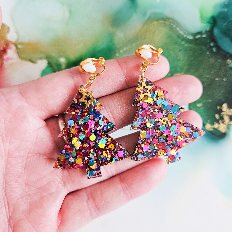 Thumbnail: handmade glitter clip on resin Christmas rainbow tree earrings on green red abstract ink background by karen horn art