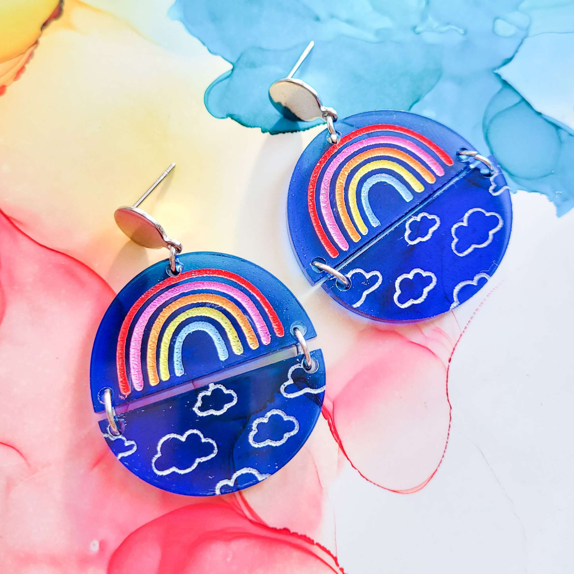 Handmade royal blue resin earrings, rainbow and cloud design