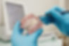 dentist-holding-dental-plastic-model-with-braces-1024x683.jpeg