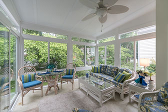 Designed for a passionate gardener, this all-season sunroom addition creates a seamless connection between the home and the backyard landscape. Featuring floor-to-ceiling glass and climate-controlled comfort, the new space serves as a year-round observation deck for the homeowner’s personal oasis.