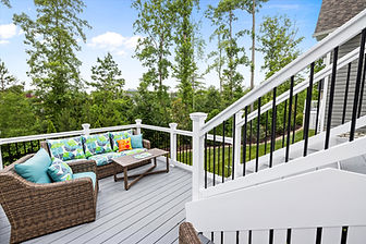 This outdoor living project seamlessly transforms an existing screened porch into a year-round sunroom and adds a new deck that incorporates the existing patio. Designed to preserve the beautiful backyard view, the multi-zone retreat features custom details like nickel gap shiplap interior siding and integrated stair lighting to create the ultimate cohesive entertaining space.