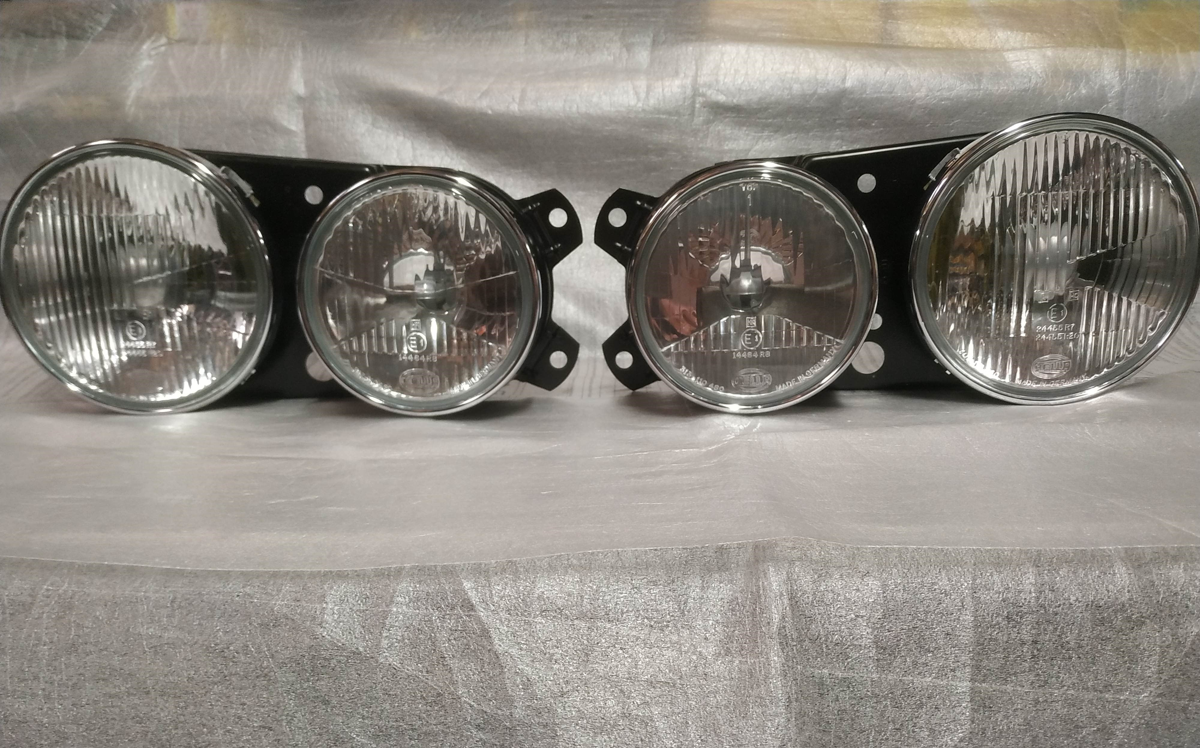 BMW E28 headlights L+R Euro Hella !NEW! NLA NOS OEM 63121367075 63121367076