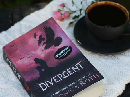 close-ip of the Divergent book in a cozy setting