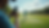 Eye-level view of a golfer recording his swing on a smartphone at the driving range