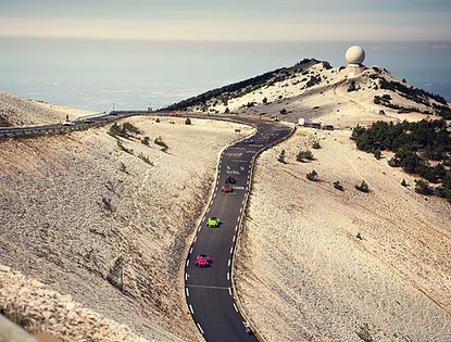 group of supercars on mount ventoux road in france
