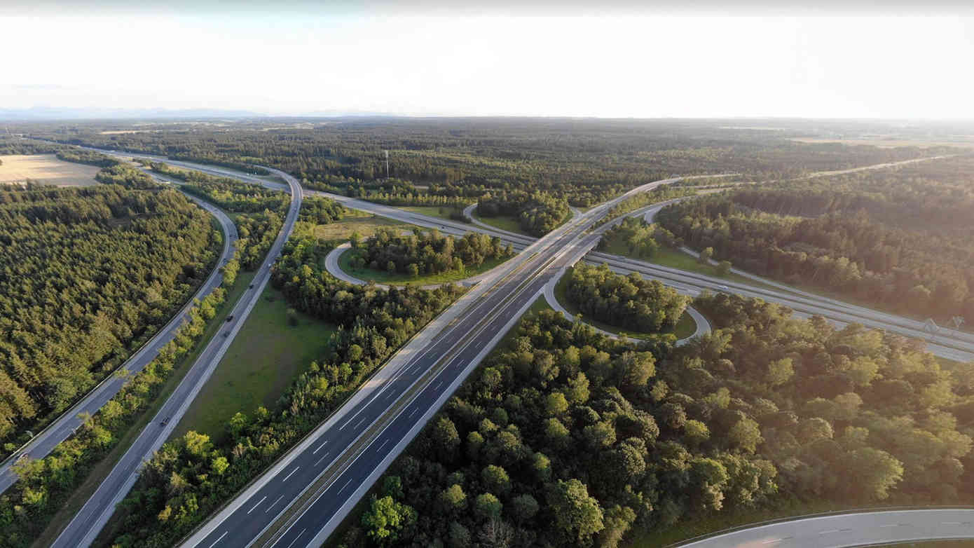 a autobahn crossing in germany from above surrounded by dent forests