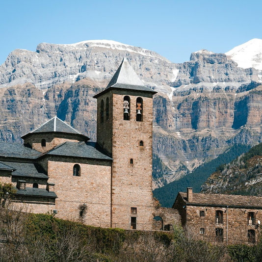 bell tower of stone church in the pyrenees