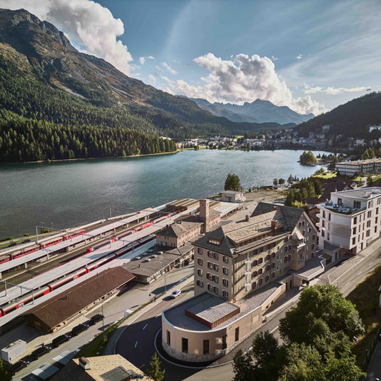 View over St. Moritz with sparkling lake and alpine peaks