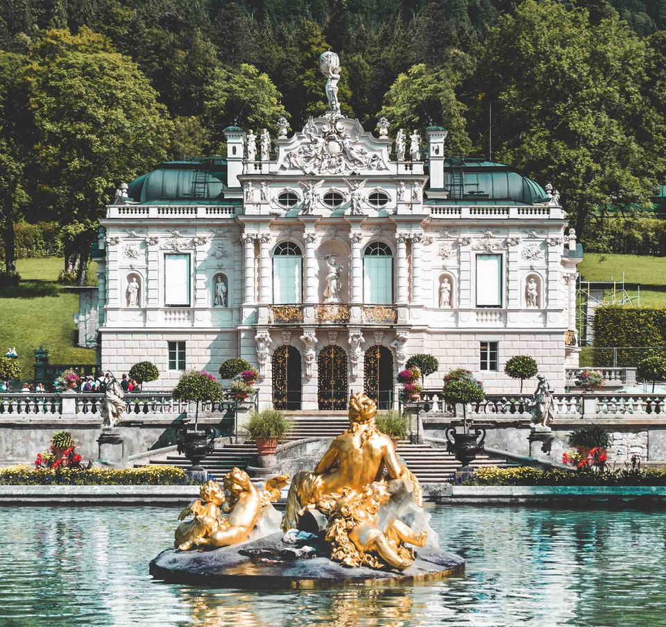 Linderhof Palace with its ornate fountain and gardens, one of King Ludwig II’s castles visited on this Bavaria driving tour.