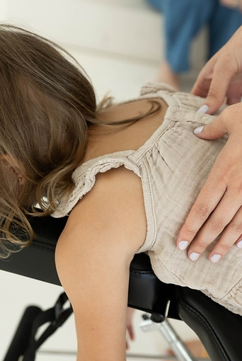 Child receiving gentle pediatric chiropractic adjustment at Soma Chiropractic Delray Beach and Boca Raton