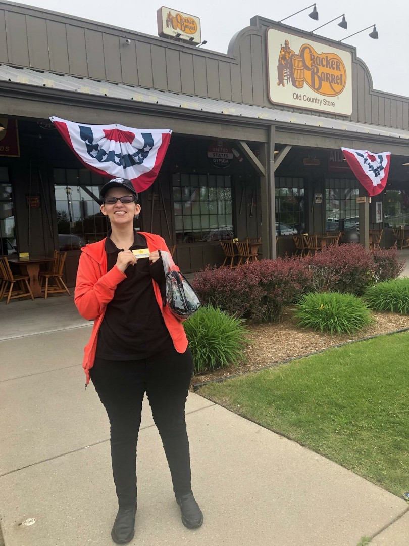 anna standing in front of cracker barrel restaurant