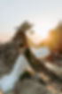 Couple kissing during WEDDINGS, beautiful wedding dress with scenic ocean background