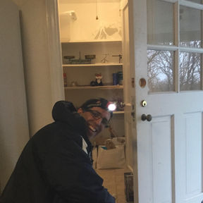 Simon Locksmith in Stamford, CT, professionally unlocking a residential front door during an emergency lockout service, demonstrating prompt and reliable mobile locksmith assistance.
