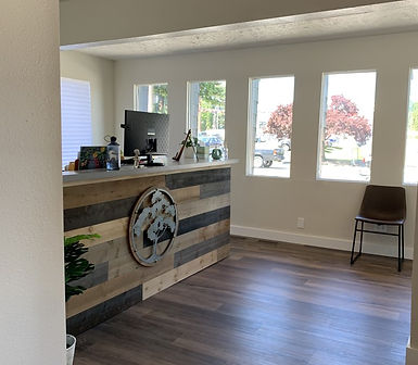 View of the front desk and light coming through the windows