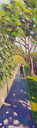 man walking down a suburban footoath dappled light