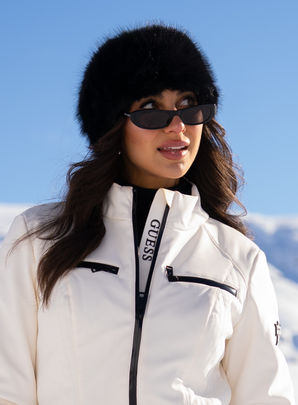 GUESS fashion influencer wearing white winter jacket during luxury photoshoot on the Pemberton Ice Cap with Headline Mountain Holidays