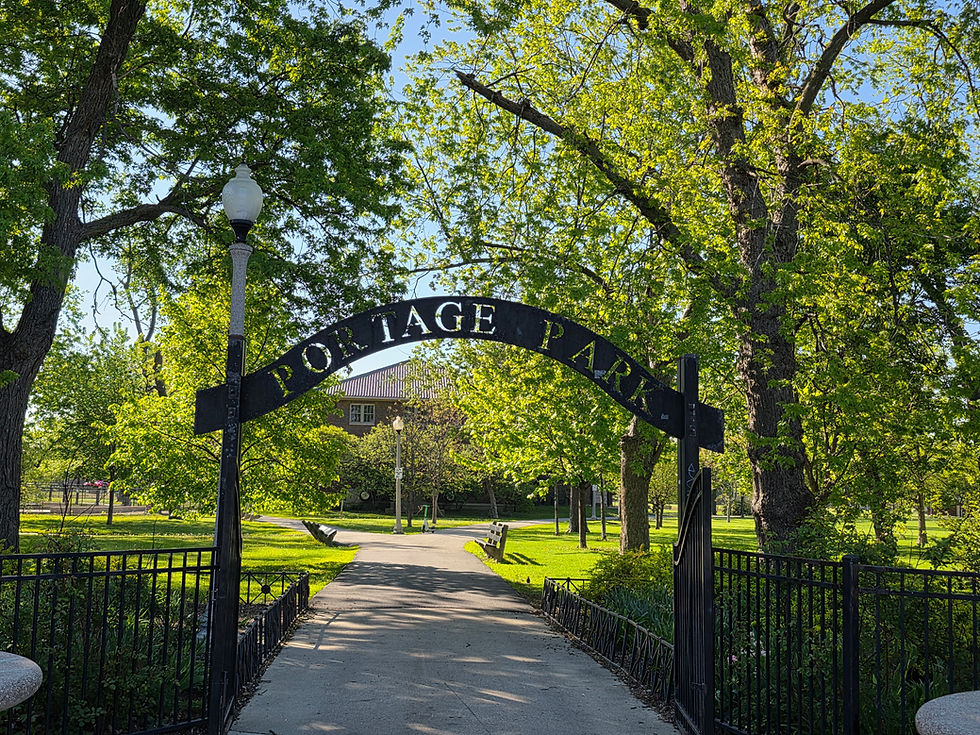 Park entrance archway sign 'IAGE PARK' over a path