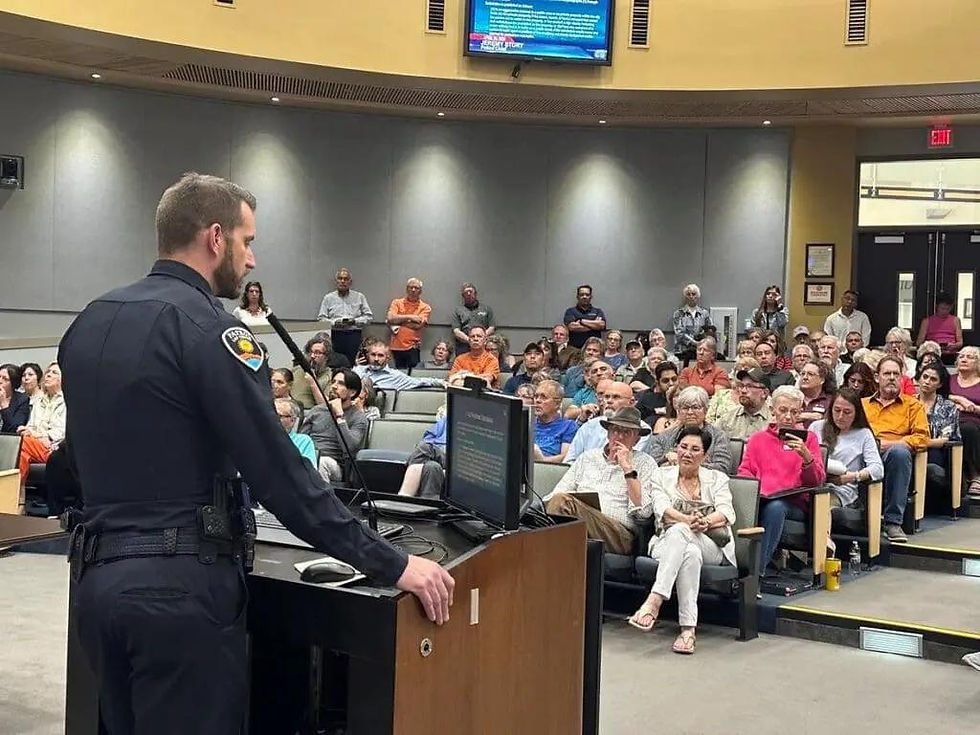 Police officer addresses community meeting