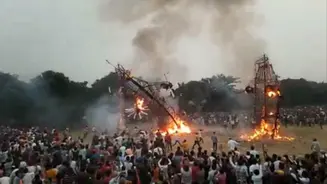 A Burning effigy of Ravana falls on the crowd during Ravan Dahan, leaving many injured