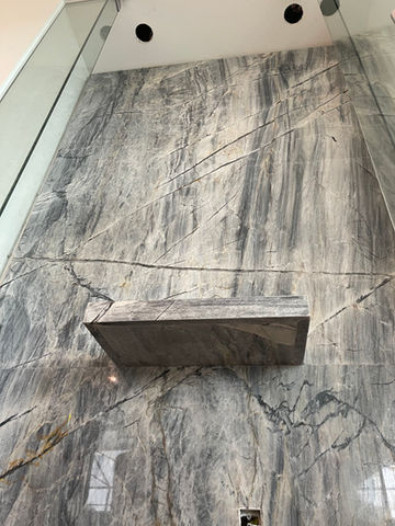Quartzite floating miter edge shower seat in Venice, FL