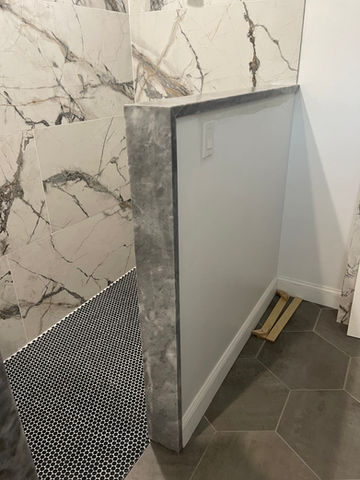 Gray Quartzite Shower curb custom fabricated in Sarasota from remnants